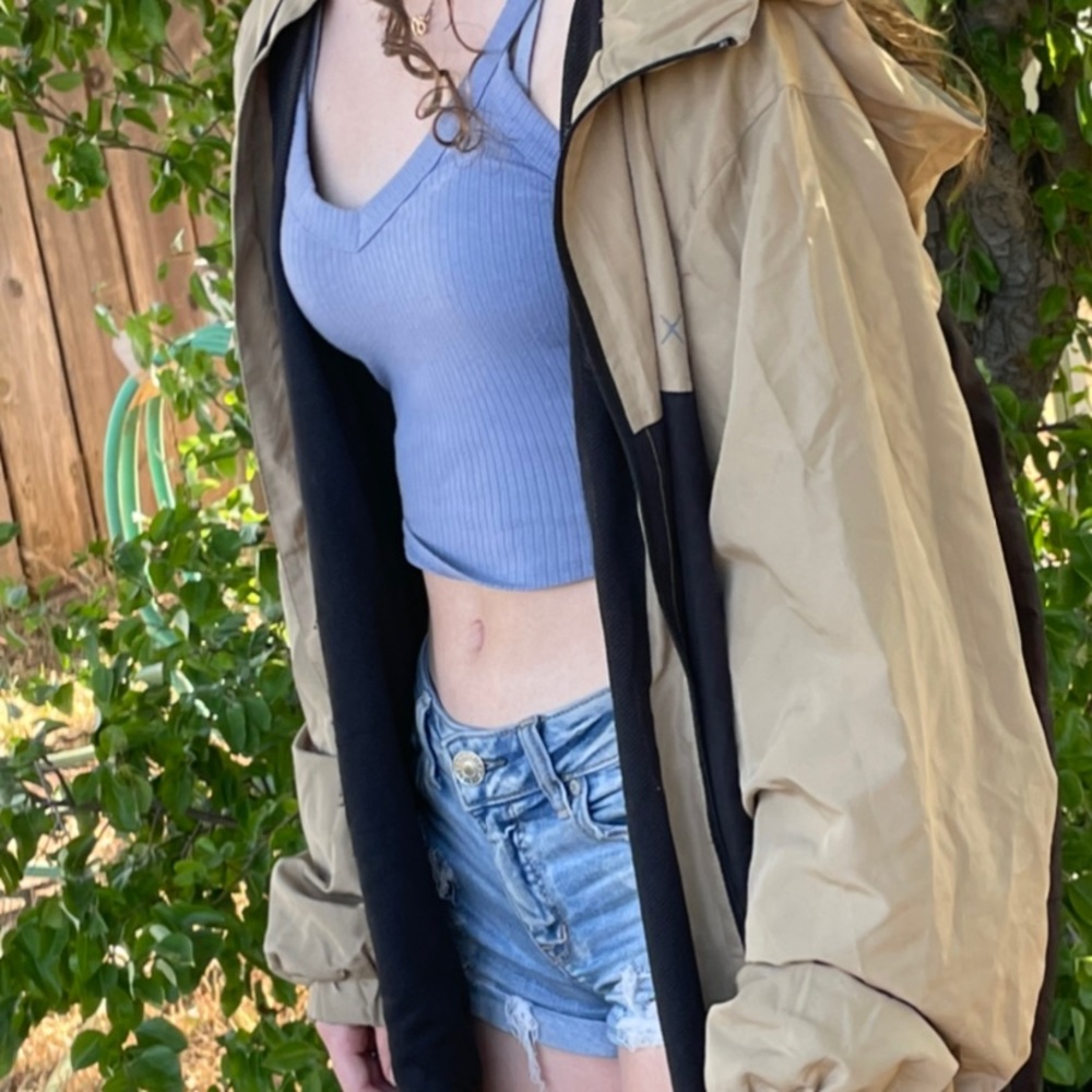 Beige and black windbreaker from Matix.